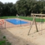 Piscina exterior i parc infantil